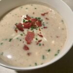 This loaded baked potato soup is topped with sour cream, cheese, and bacon