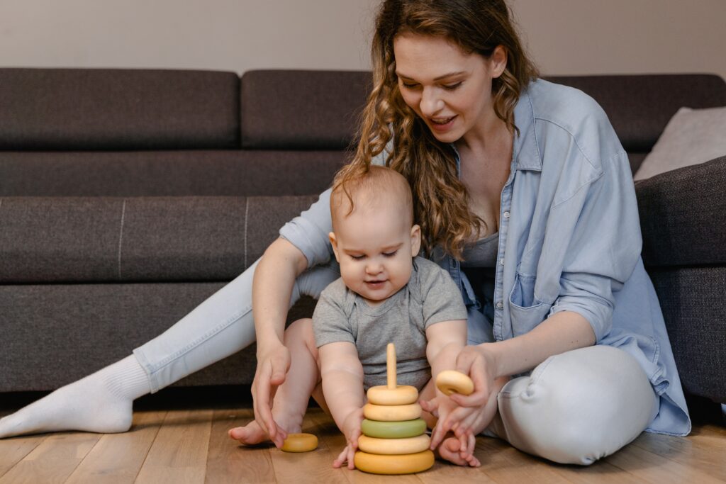 Mom and baby playing with stacking toys